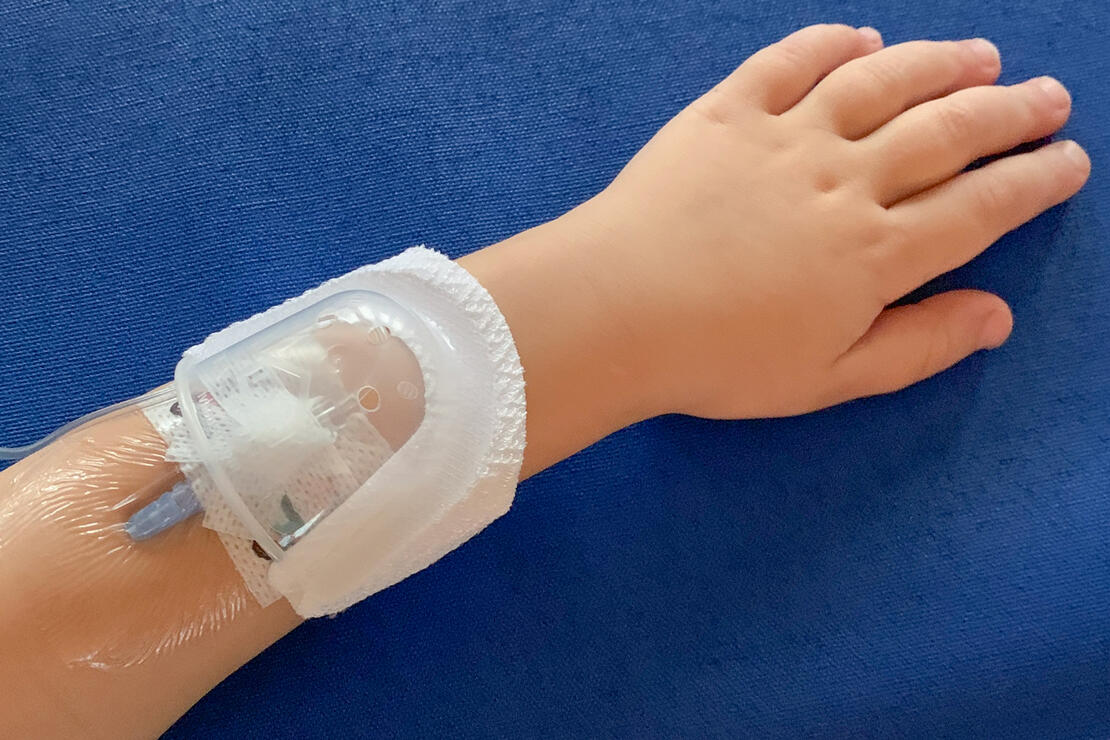 330L I.V. House UltraDressing on child's forearm