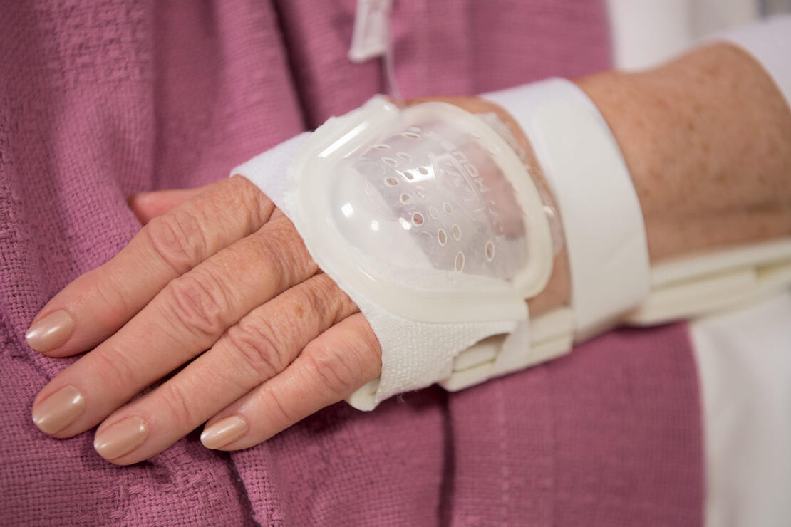 730L I.V. House UltraDressing on older adult's hand