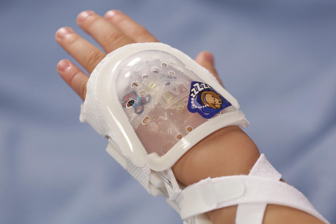 730S I.V. House UltraDressing protects I.V. insertion site on child's hand