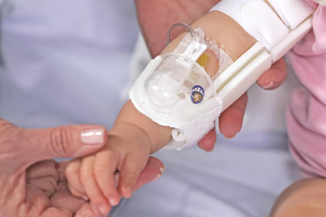 330L I.V. House UltraDressing on infant's elbow