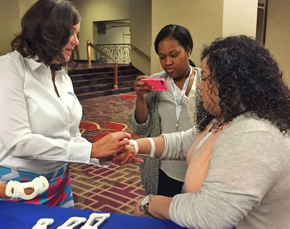 Demonstrating TLC Wrist Splint at conference