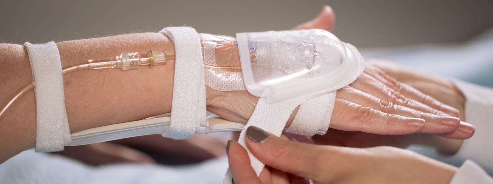 I.V. House UltraDressing and TLC Wrist Splint on adult's hand and wrist