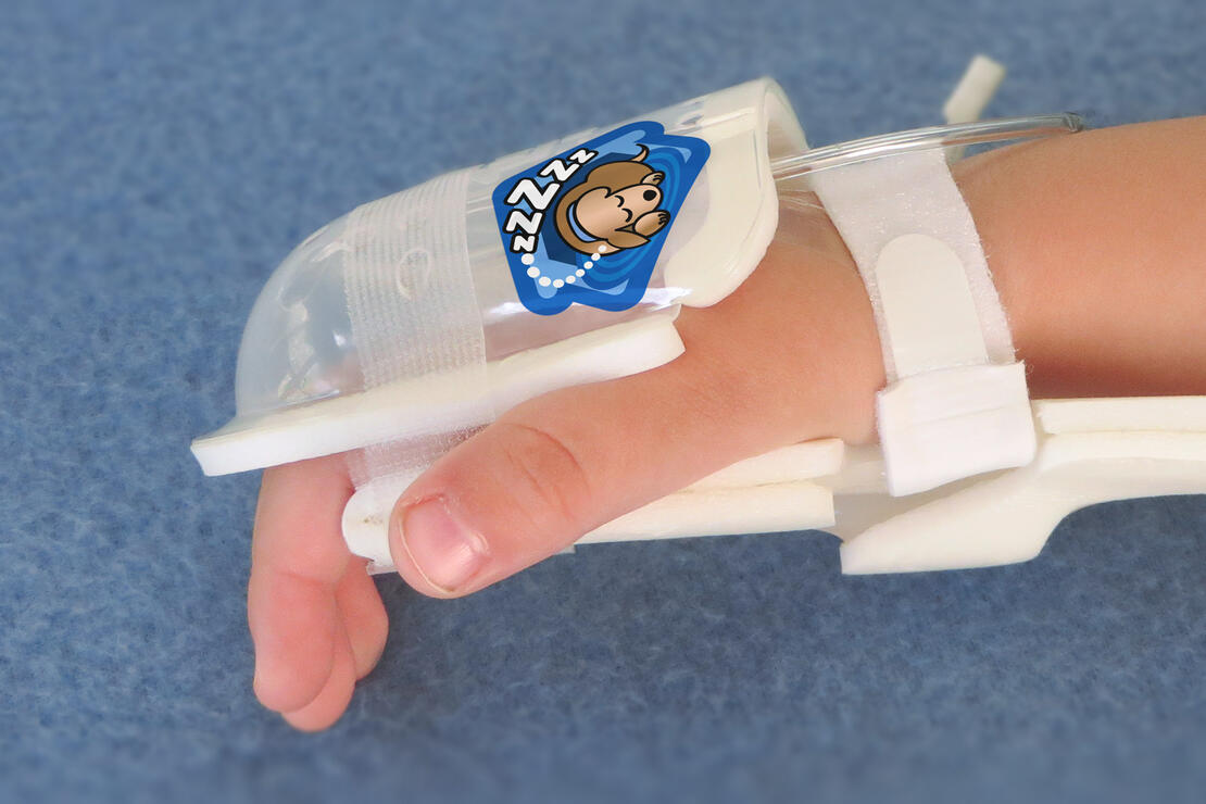 750LFP I.V. House UltraDome on toddler's hand