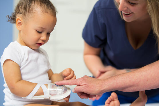 TLC Wrist Splint and I.V. House UltraDressing on a toddler