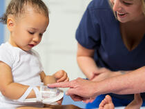 TLC Wrist Splint and I.V. House UltraDressing on a toddler