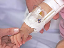 330L I.V. House UltraDressing on infant's elbow